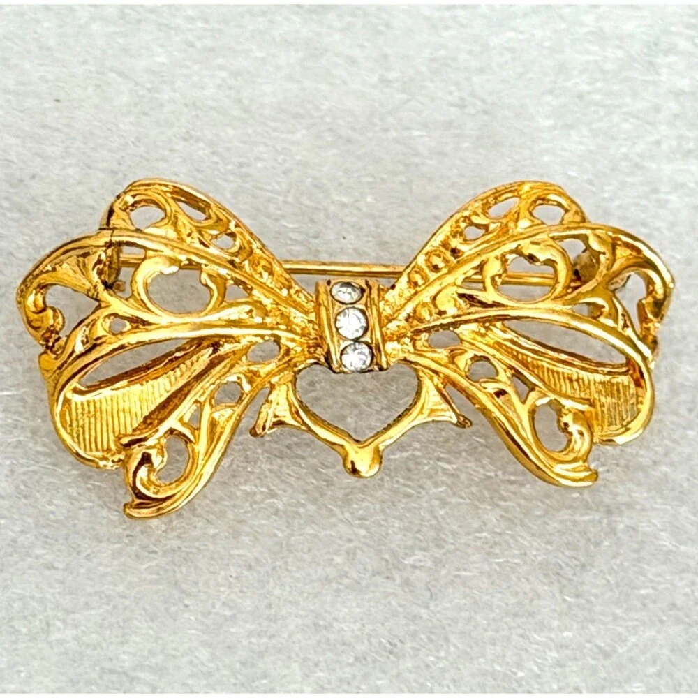 Vintage Gold Tone Openwork Filigree Bow Brooch Rhinestone Accent Pin